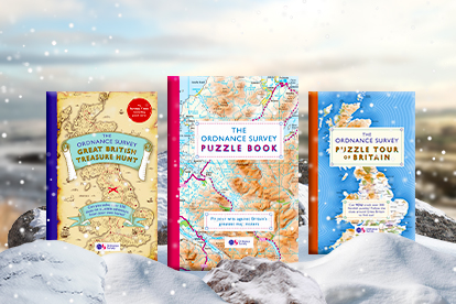 Picture of several OS Puzzle books on a snow  covered backround