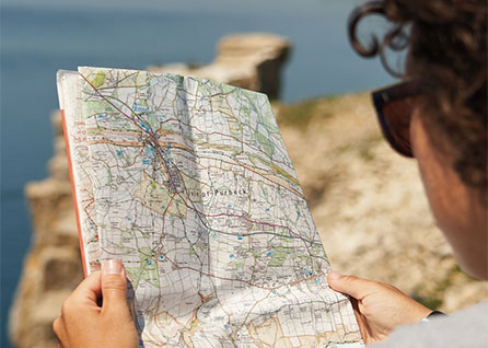 Woman looking at OS Paper Map